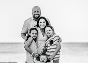 A black and white photo of Michael Conforto with his family